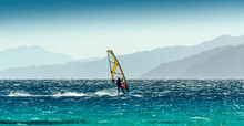 Windsurfer Rides On A Background Of High Mountains In Egypt Dahab South Sinai