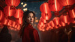 Young woman standing with red lantern background