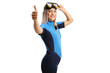 Woman wearing a diving suit and mask and gesturing thumbs up