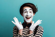 Photo Portrait of a happy mime on turquoise background. ai generative