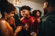 © Vorda Berge - Smiling group of young African American people drinking together