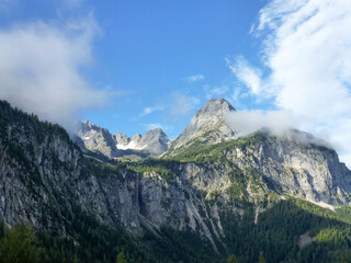 A bright mountain landscape with picturesque mountain slopes under a bright sky