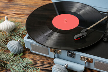 Poster - Vintage vinyl record player with Christmas decorations on wooden background