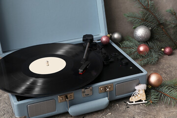 Wall Mural - Vintage turntable with Christmas decorations on grey grunge background