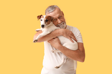 Sticker - Senior man with cute dog on yellow background