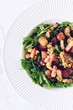 Tasty salad with arugula, grapes, bacon and fennel seeds 
