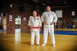 © guruXOX - Two respected and experienced judo sensei master instructor in traditional gi kimono. A skilled martial artist demonstrates his expertiset