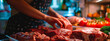 A woman puts meat in the refrigerator. Selective focus.
