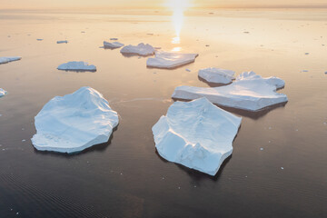 Wall Mural - Melting icebergs by the coast of Greenland, on a beautiful summer day - Melting of a iceberg and pouring water into the sea. Global warming
Arctic nature landscape, Summer day