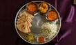 Vegetarian Indian thali, Indian home food with lentil dal, paneer, roti, rice, curd and chutney, Hindu Veg Thali, Indian Food Thali.