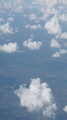 Wall Mural - vertical cloudscape from plane