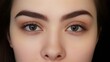 permanent eyeliner makeup close up. Healthy and clean skin young woman