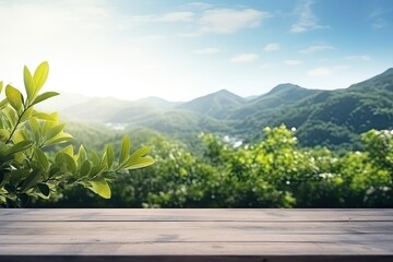 Wall Mural - Empty table with blurred mountain backdrop sunny sky and foliage