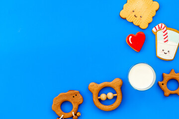 Wall Mural - Funny cookies in shape of milk in glass and biscuit with kids toys