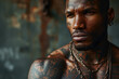 Cool brutal African American man with tattoos, muscular handsome adult guy looking away
