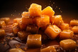 Close-up of caramel cubes in the shape of a pyramid along which liquid caramel flows, generated ai
