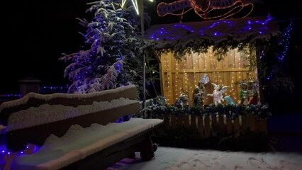 Wall Mural - christmas nativity scene covered with snow at night, beautiful christmas night with decorated nativity scene and star
