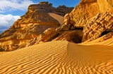 Fototapeta Góry - Sand dune and rocks in the Sahara desert