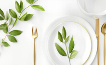 Festive Wedding, Birthday Or Christmas Table Setting With Golden Cutlery, Porcelain Plate And Green Eucalyptus Plant. Top View