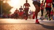 © LoLArt - Close up photo of lower body of a group of runners running in a road race or marathon run contest