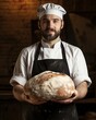 Artisan Baker: Young Male Baker Holding Large Round Loaf of Bread
