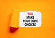 © Dzmitry - You make your own choice symbol. Concept words You make your own choice on beautiful white paper. Beautiful orange paper background. Business you make your own choice concept. Copy space.