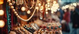 Fototapeta  - Festive indoor market with handmade jewelry booth. Pop-up event in mall for entrepreneurs. Photographed with tilt-shift lens, creating selective focus and bokeh.