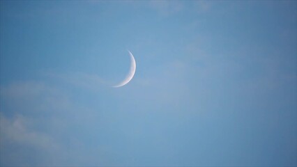timelapse video of the moon with blue sky in the evening ligh
