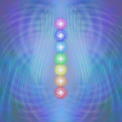 Wall Mural - The Seven Major Chakras blue matrix background -  a neat stack of seven rainbow coloured chakra vortexes against a radiating purple blue matrix wave background with copy space
