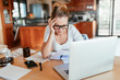 © Geber86 - Focused Woman Working on Finances at Home