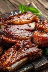 Wall Mural - barbecue ribs with sauce. Food recipe background. Close up