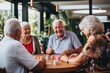 Diverse group of senior people playing cards in nursing home