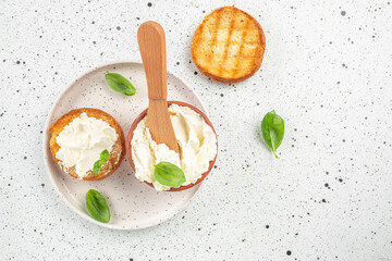 Wall Mural - bread with cream cheese on a light background. Detox and clean diet concept. place for text, top view