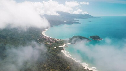 Poster - Beach in Brazil. Aerial view of the coastline with perfect sandy beaches, blue sea and clouds flying in the sky. Drone flies through the cloud