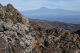 Fototapeta  - Beautiful mountain views on tourist trail from San Sebastian de la Gomera to El Cedro Forest in Garajonay National Park. Teide mountain on Tenerife on horizon. La Gomera, Canary Islands, Spain