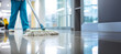 © Pajaros Volando - Close-up of a hospital cleaning staff using mop in floor hall