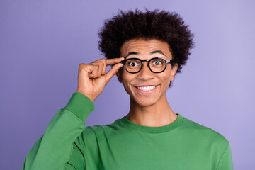 Poster - Photo of funky excited man dressed green sweater arm spectacles smiling isolated violet color background