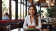 Beautiful latin young woman sitting alone in modern restaurant at lunch time