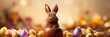little cute brown bunny sitting inside a chocolate easter egg with colourful eggs next to him banner with copy space