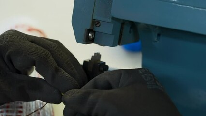 Poster - Close up of engineer soldering wires at the factory. Creative. Using professional equipment.