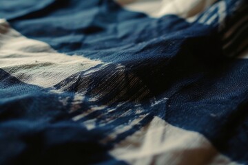 Poster - A close-up view of a blue and white blanket. Perfect for adding a touch of color and comfort to any home decor