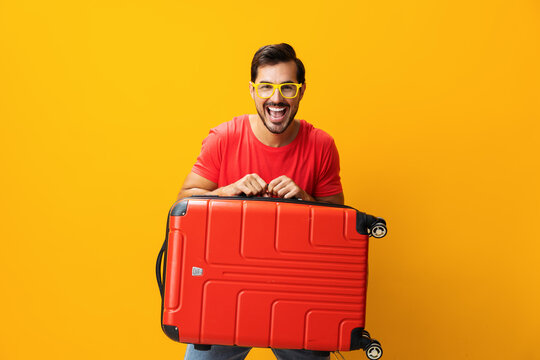Man studio flight yellow vacation baggage background traveler travel journey suitcase happy trip