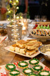 Desserts on a table for a Christmas celebration, ice-cream sandwich and plum puddings