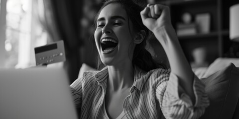 Poster - A woman sitting on a couch holding a credit card. This image can be used to represent online shopping, financial transactions, or making purchases