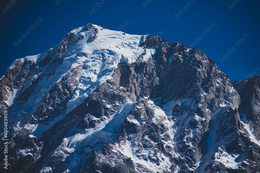 Snow covered mountains against clear blue sky. Stock Photo | Adobe Stock