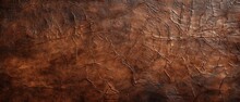A Brown Leather Surface With Cracks