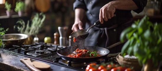 Poster - Chef puts tomato paste from tube into pan with meat on gas stove. Creative Banner. Copyspace image