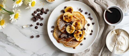 Poster - Corn pancakes with caramelized bananas natural yogurt and chocolate chips on white plate Girl eating pancakes for breakfast First person view top view. Creative Banner. Copyspace image