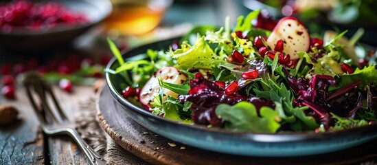 Poster - Colorful winter salad with mixed greens Belgian endives and pomegranate seeds. Creative Banner. Copyspace image
