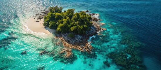 Poster - Aerial view of a beautiful tropical island surrounded by coral reef and a clear ocean. Creative Banner. Copyspace image